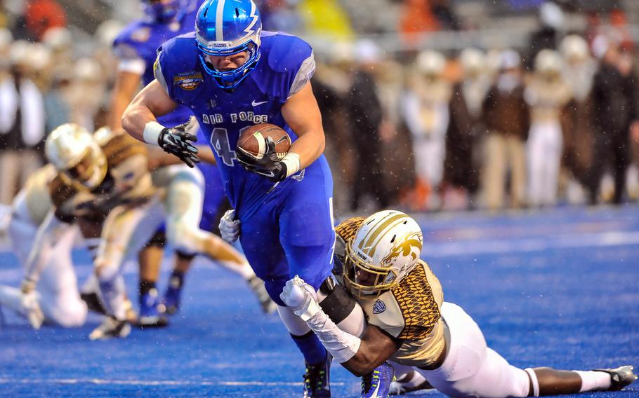 Air Force Falcons Shayne Davern breaks away from the Bronco?s defense during the first half of the Idaho Potato Bowl game against Western Michigan on Saturday, December 20, 2014, in Boise, Idaho.