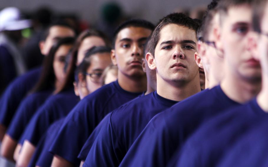 Marine recruit Poolees prepare to swear in during a ceremony at the Stubhub Center before the 2015 Semper Fidelis All-American Bowl on Jan. 4, 2015 in Carson, Calif.