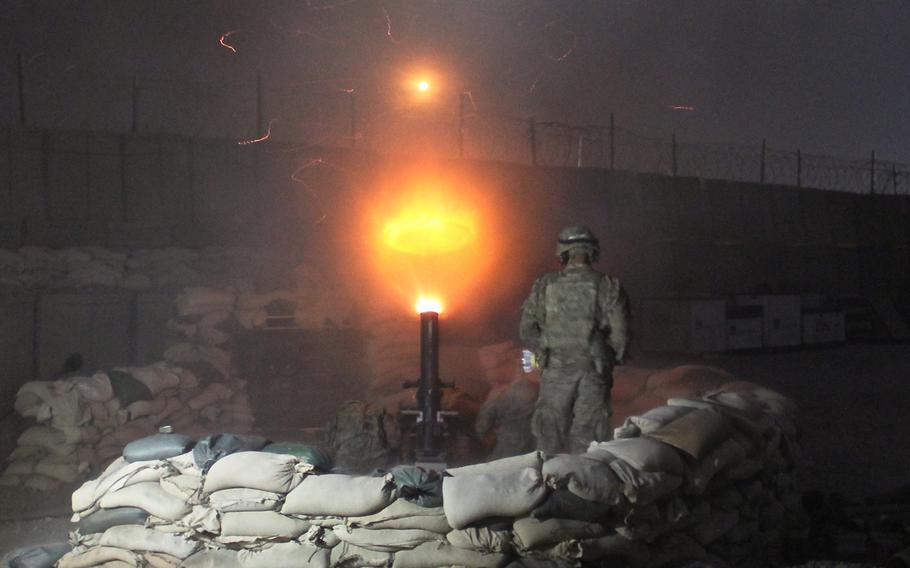 Soldiers from Fires Squadron, 3rd Cavalry Regiment, Train, Advise, Assist Command - East brighten the night sky over Tactical Base Gamberi, Afghanistan, using the M120 mortar during a fires training mission Jan. 1, 2015.