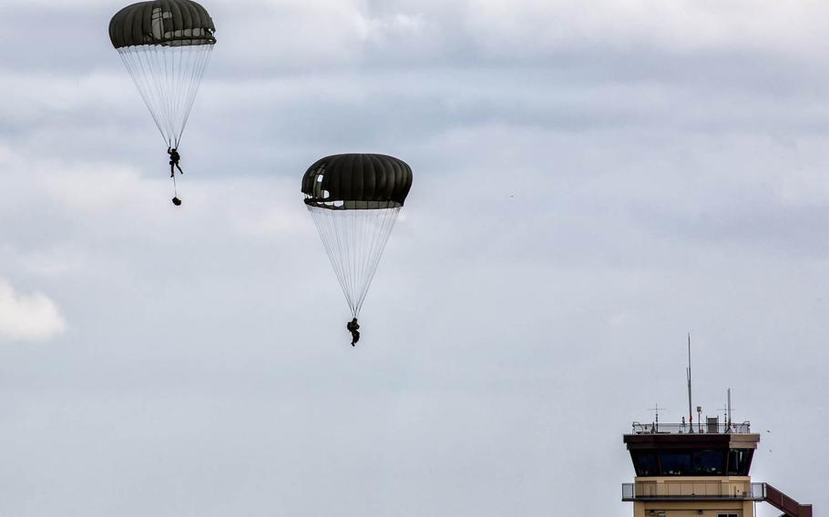 31st Rescue Squadron pararescuemen descend after jumping from a C-130 Hercules during ?Jump Week? at Yokota Air Base, Japan, on Tuesday, Jan. 6, 2015.  During Jump Week, airmen train to maintain mission readiness and rescue tactics in preparation for real-world emergencies.