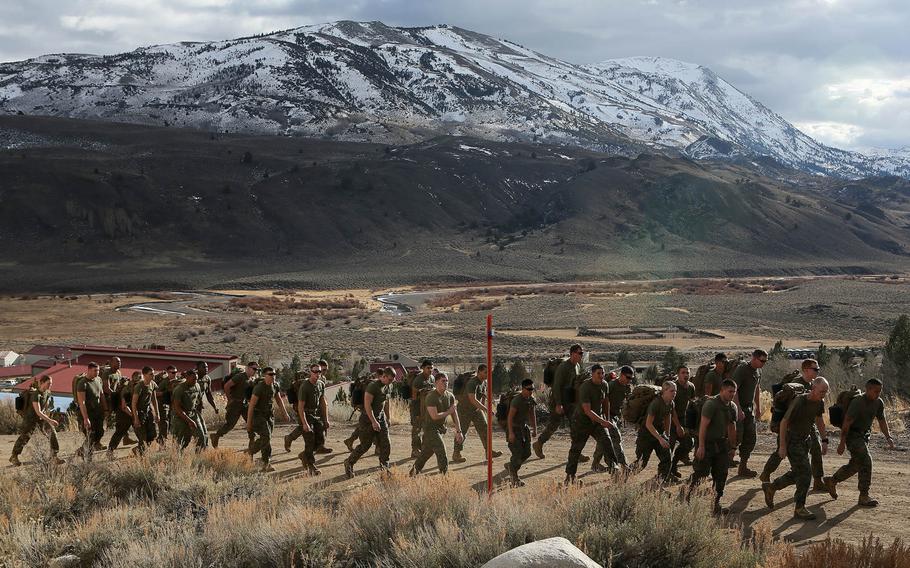 U.S. Marines with Headquarters Company, Combat Logistics Battalion 26, 2nd Marine Logistics Group, conduct a 5 mile hike on the U.S. Marine Corps Mountain Warfare Training Center in Bridgeport, Calif., Jan. 11, 2015. MWTC trains Marines across the warfighting functions for operations in mountainous, high altitude and cold weather environments.
