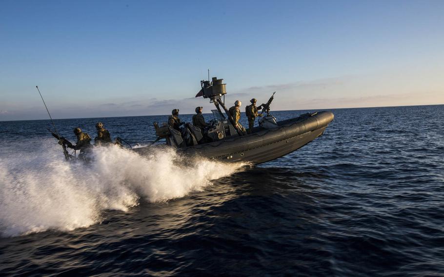 U.S. Navy Sailors and Marines with the 15th Marine Expeditionary Unit's Maritime Raid Force drive Rigid-Hulled Inflatable Boats during maritime interoperability training off the coast of Camp Pendleton, Calif., Jan. 12, 2015.