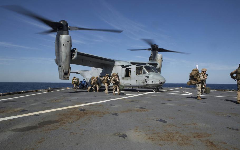Mortarmen with Weapons Company, Battalion Landing Team 3rd Battalion, 6th Marine Regiment, 24th Marine Expeditionary Unit, disembark from an MV-22B Osprey from Marine Medium Tiltrotor Squadron 365, aboard the dock landing ship USS Fort McHenry, Jan. 12, 2015. The 24th MEU is embarked with the Fort McHenry as part of the Iwo Jima Amphibious Ready Group and deployed to maintain regional security in the U.S. 5th Fleet area of operations.