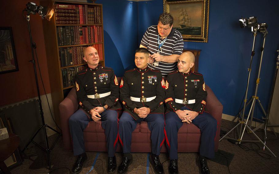 Staff Sgt. Ben Shoemaker (left), Sgt. Ricardo Schebesta and Staff Sgt. Bryson Twigg, Marine recruiters who helped stop a Jan. 6, 2015, robbery in Lynnwood, Wash., joke together while being prepared for a remote interview from Seattle on Fox News? ?Fox & Friends? morning show Jan. 14, 2015.