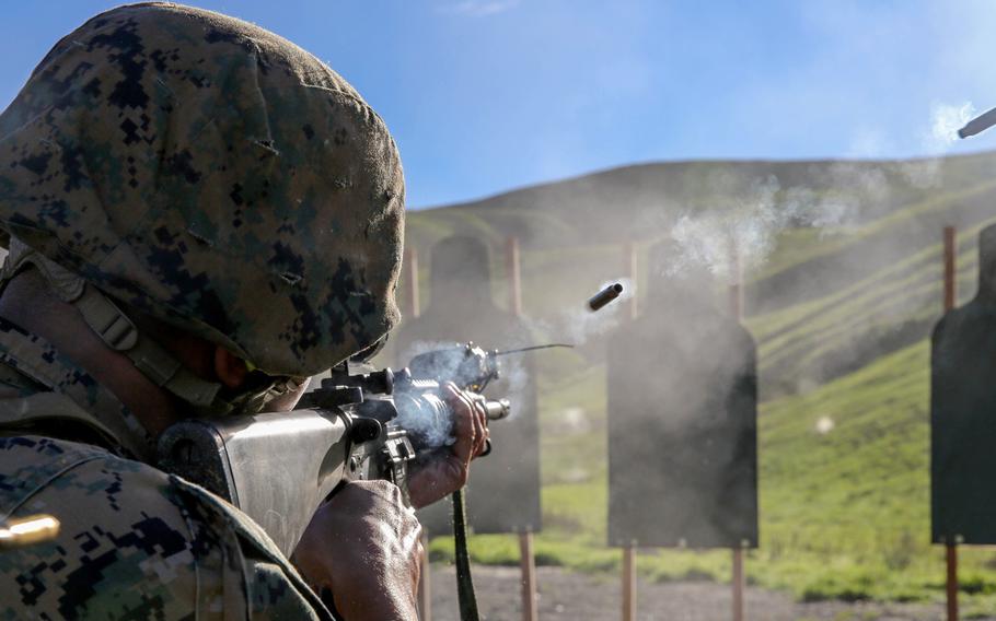 Gunnery Sgt. Michael Woods, with Marine Wing Communications Squadron 38, shoots an M16A4 rifle on Range 109 during Back in the Saddle training at Marine Corps Base Camp Pendleton, Calif., on Jan. 7, 2015.