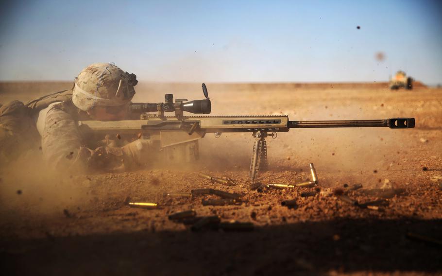 U.S. Marine Cpl. Kaden Prickett, machine gunner with Company, 2nd Battalion, 7th Marine Regiment fires a .50-caliber Special Applications Scoped Rifle at a target 1,200 meters away, in the Central Command area of operations, Jan. 6, 2015.