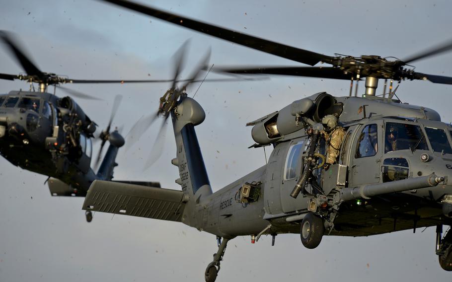Two 56th Rescue Squadron HH-60G Pave Hawks respond in a combat search and rescue scenario on RAF Lakenheath, England, on Friday, Jan. 16, 2015.