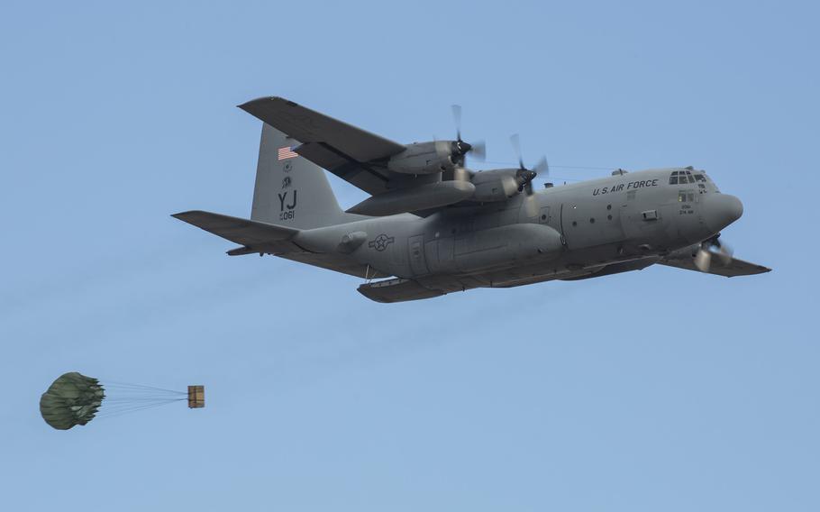 A C-130 Hercules drops light equipment payloads on Jan. 14, 2015, during a Samurai Readiness Inspection at Yokota Air Base, Japan.