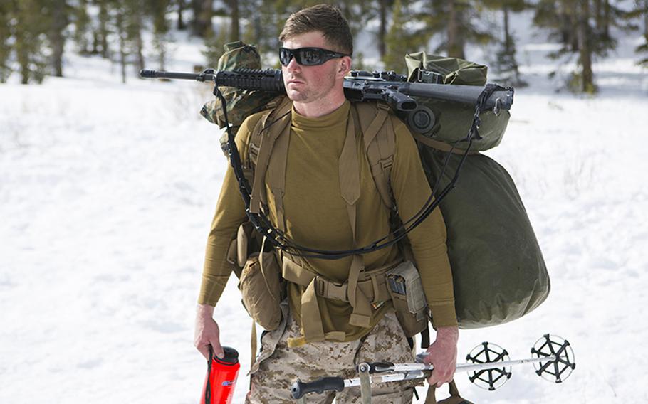 U.S. Marine Lance Cpl. Robert Wilcox, a water support technician with Combat Logistics Battalion 26, 2nd Marine Logistics Group, prepares for his next movement at the U.S. Marine Corps Mountain Warfare Training Center on Bridgeport, Calif., on Jan. 26, 2015.