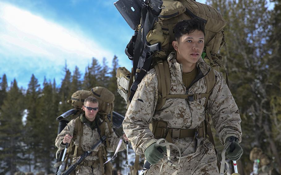 Lance Cpl. Henry Ramirez, a landing support specialist with Combat Logistics Battalion 26, Headquarters Regiment, 2nd Marine Logistics Group, steps off with his Marines during a movement aboard U.S. Marine Corps Mountain Warfare Training Center at Bridgeport, California, on Jan. 26, 2015.