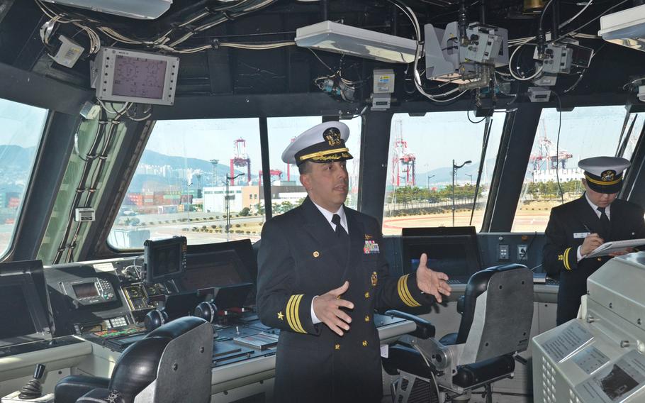Cmdr. Matt Kawas, commanding officer of the littoral combat ship USS Fort Worth, speaks about the the ship's capabilities while in Busan on Saturday.