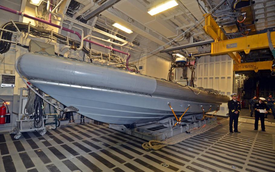 The littoral combat ship USS Fort Worth carries a rigid-hulled inflatable boat, or RHIB, as part of its surface warfare module. The ship is also meant to swap out the boat for equipment related to mine warfare and anti-submarine missions, but deployment of those modules has been delayed.