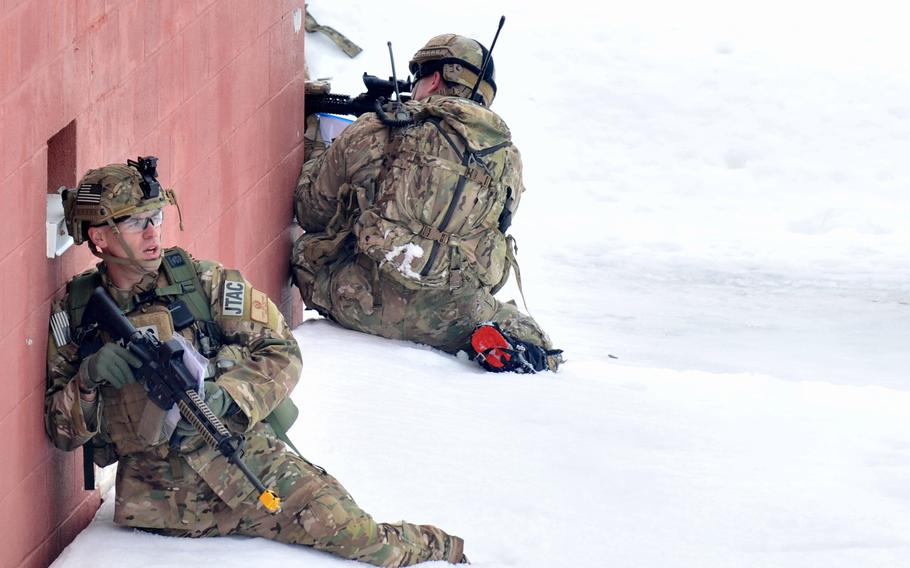 Capt. Jeffrey Hansen, with tactical air control, establishes a perimeter and firing team during an exercise at Fort Drum, N.Y., on March 14, 2015.