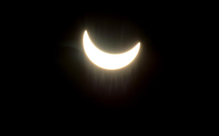 The moon moves across the face of the sun at  10:31 a.m. during a partial solar eclipse over Kaiserslautern, Germany, on the first day of spring, Friday, March 20, 2015.