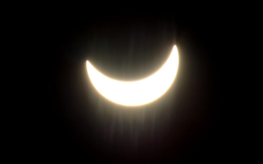 The moon moves across the face of the sun at  10:38 a.m. during a partial solar eclipse over Kaiserslautern, Germany, on the first day of spring, Friday, March 20, 2015.