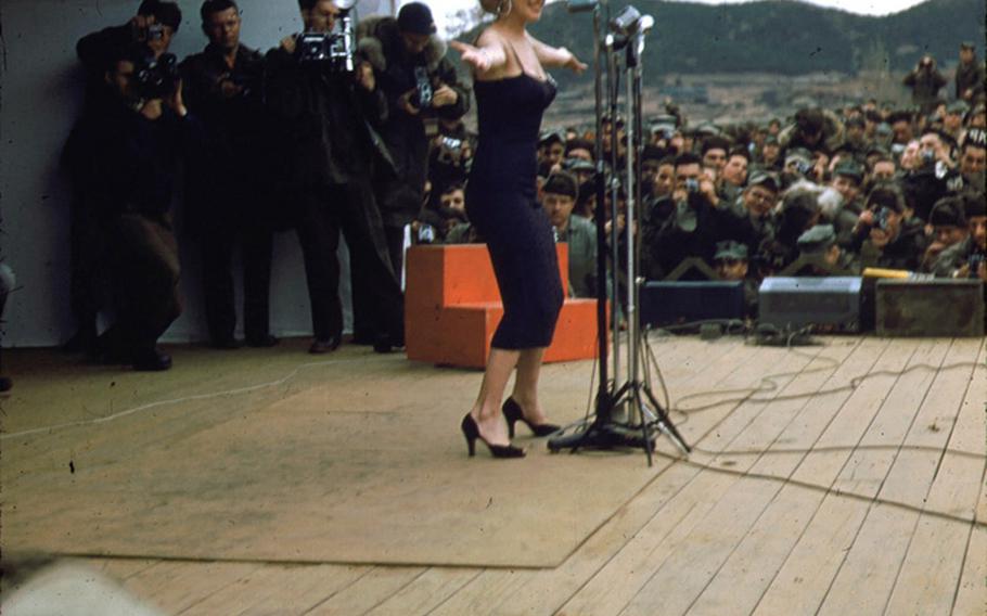 Marilyn Monroe appears onstage entertaining troops on her USO tour through Korea in 1954. A stone dedication at Inje County's Catholic church square will recall an era when some of America's biggest stars came to Korea to visit servicemembers.