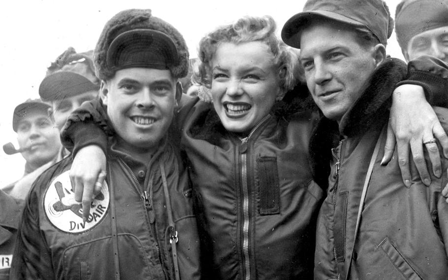 Marilyn Monroe poses with Pfc. John Fenesy, left, of Caldwell, N.J., and Cpl. Dick Armstrong of Williston Park, N.Y., at the 3rd Division airstrip in Korea on February 20, 1954. Inje County, located in the picturesque but sparsely populated northeast, is building a $9,150 dedication to Marilyn Monroe?s 1954 USO show.