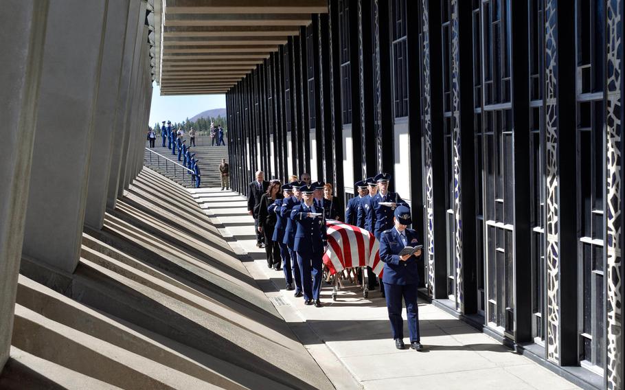 Rabbi (Maj.) Sarah Schechter reads from the Torah while the honor guard escorts the casket containing the remains of Capt. Richard D. Chorlins, an 1967 graduate of the Air Force Academy into the Cadet Chapel on April 14, 2015. Chorlins was killed in Vietnam in January 1970, and his remains were laid to rest at the Academy Cemetery.