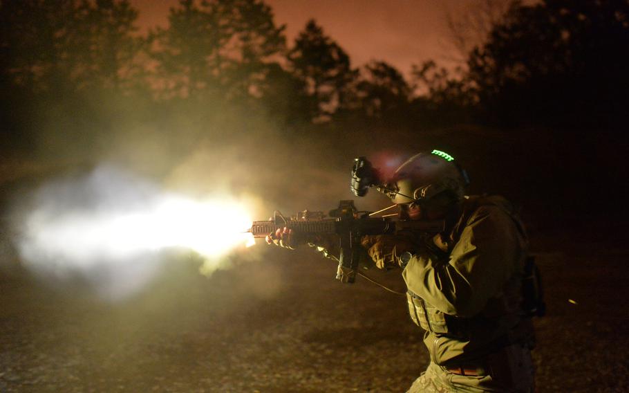 Tech. Sgt. Jason Cangemi, with the 106th Rescue Wing, test fires an M4 carbine without a suppressor during a multi-day training course at the firing range in Westhampton Beach, N.Y., on April 9, 2015.