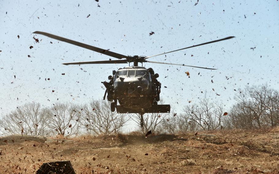 An HH-60 Pavehawk from the 101st Rescue Squadron lands to pick up simulated casualties during 106th Rescue Wing's Security Forces Squadron training at Camp Smith, N.Y., on April 12, 2015.