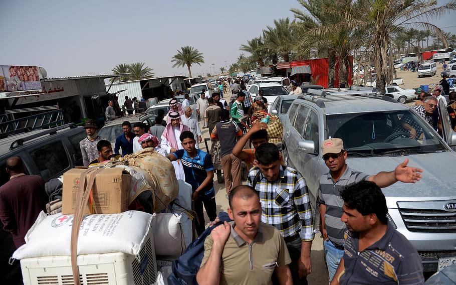 Thousands of people flee fighting between Iraqi forces and the Islamic State in Anbar province, Iraq, in April 2015. Fear of the group's brutality sent tens of thousands of people seeking safety in Baghdad and other areas.