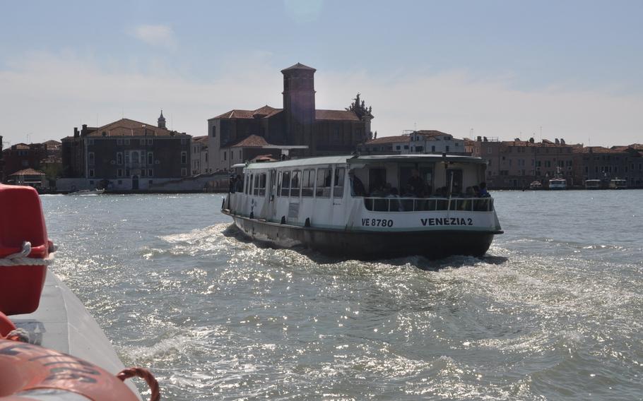 A water bus heads back to the main part of Venice, Italy, after stopping at Murano. Murano, home to the famous Venetian glass, can be reached only by boat.