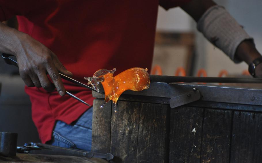 A horse starts to take shape at the hands of Lwapgan Suranga, who has been practicing his art at the Guarnieri glass factory on Murano in Venice, Italy, for about 14 years.