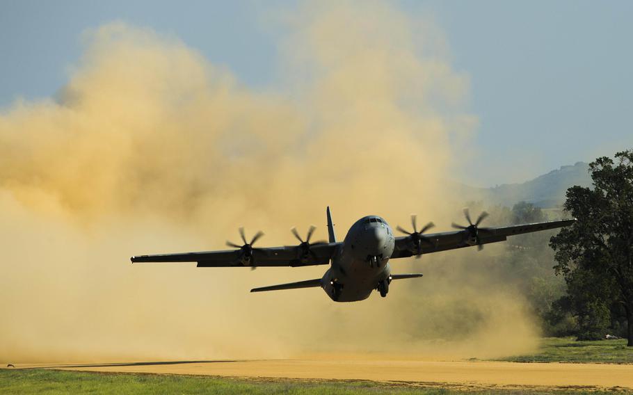 A C-130 Hercules takes off at Fort Hunter Liggett, Calif., during Exercise Golden Hydra on Tuesday, March 31, 2015. More than 130 airmen from five wings across Air Mobility Command and the Air National Guard participated in a contingency response exercise March 29 through April 3 at three locations in California.
