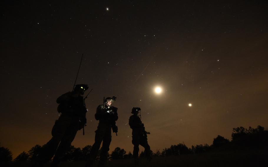 U.S. Air Force combat controllers, 21st Special Tactics Squadron, observe an AC-130 Gunship conduct a live-fire mission during Emerald Warrior at Camp Shelby, Miss., on April 22, 2015.