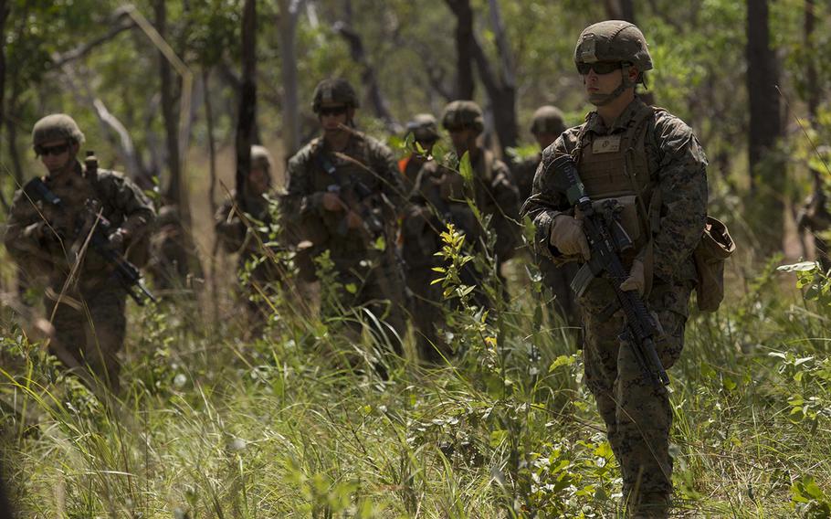 U.S. Marine infantrymen with 1st Battalion, 4th Marine Regiment, Marine Rotational Force ? Darwin, go on patrol during a live-fire exercise April 28, 2015, at Kangaroo Flats Training Area, Northern Territory, Australia.