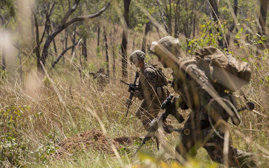 U.S. Marine infantrymen with 1st Battalion, 4th Marine Regiment, Marine Rotational Force ? Darwin, run to cover as targets are called out during a squad assault drill April 28, 2015, at Kangaroo Flats Training Area, Northern Territory, Australia.
