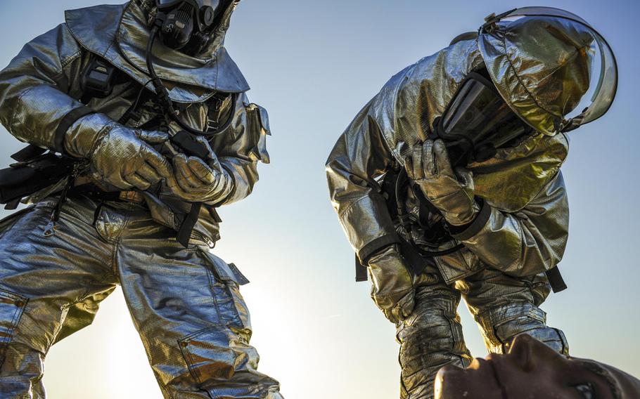Staff Sgt. Nathan Williams and Senior Airman Justin Caldwell, 19th Civil Engineer squadron firefighters inspect a simulated casualty as part of a major accident response inspection on April 22, 2015, in Jacksonville, Ark.