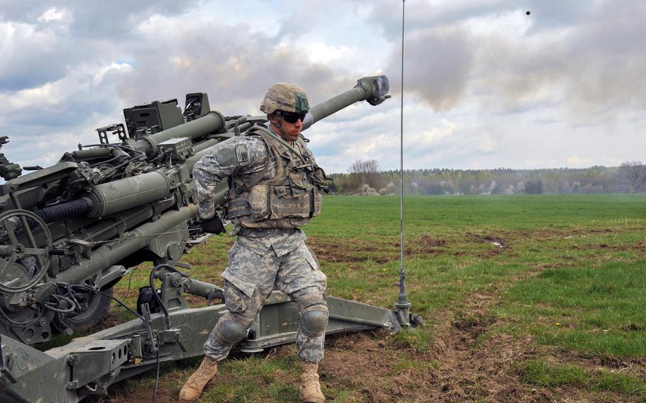 Spc. Leandro Gomez, a paratrooper assigned to 173rd Airborne Brigade, fires a M777A2 Howitzer during a live fire exercise at the 7th Army Joint Multinational Training Command's Grafenwoehr Training Area, Germany, April 30, 2015.