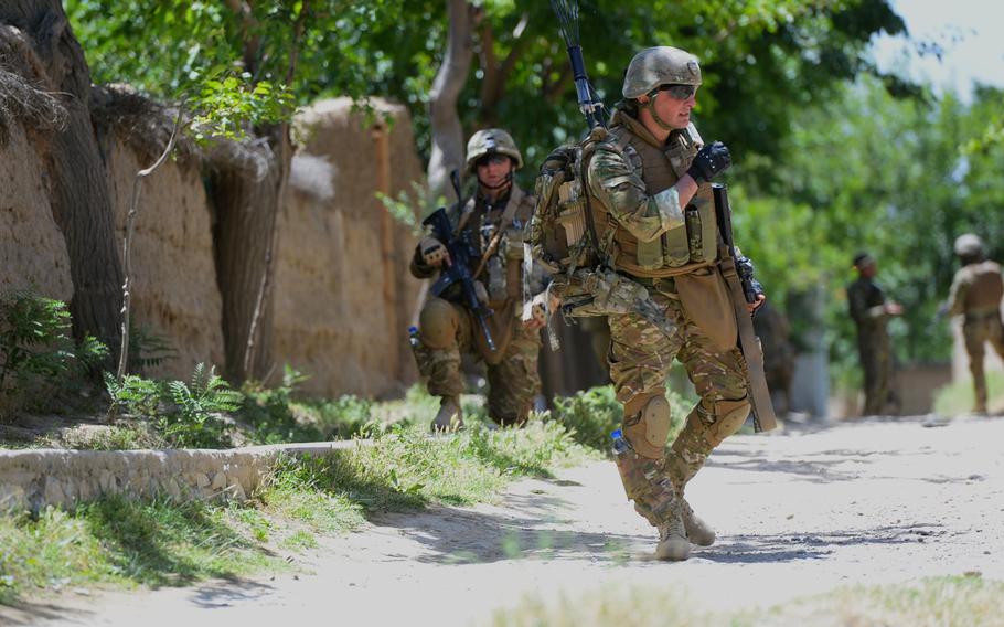 A member of the 43rd Georgian Light Infantry Battalion moves into position during a June 10, 2015, joint force protection mission with U.S. forces outside Bagram Air Field in central Afghanistan.