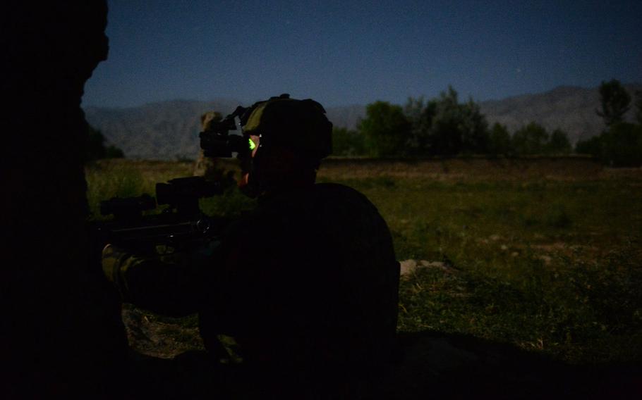 A Czech soldier with 4th Lion Company scans a suspected rocket launch site outside Bagram Air Field during a June 3, 2015, surveillance patrol with U.S. forces in Parwan province, central Afghanistan.