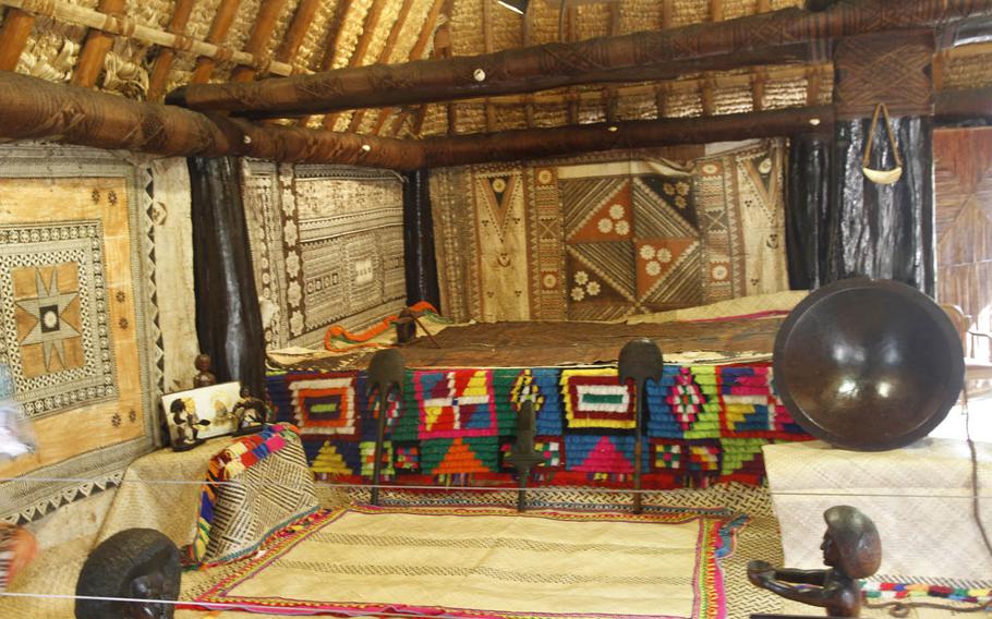 Colorful patterns adorn the bed in the chief's home in the the Fiji village. In traditional Fiji culture, the chief had the largest, most opulent home on ground higher than all others.