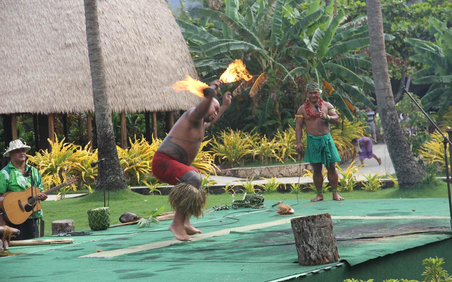 A fire dancer shows how it's done where he comes from during a presentation at Samoa village.