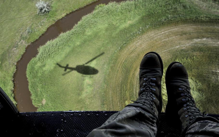 A UH-N1 Iroquois circles during a search-and-rescue training mission near Garrison, N.D., on Monday July 20, 2015. The crew practiced search-and-rescue operations in preparation for the upcoming Air Force Global Strike Command's Global Strike Challenge.