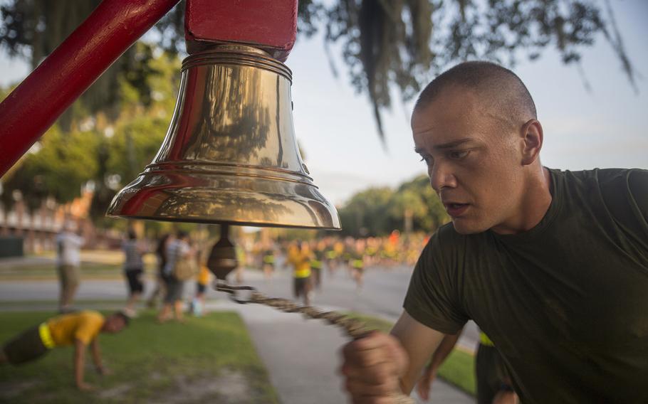 A new Marine of Hotel Company, 2nd Recruit Training Battalion, rings the 2nd Recruit Training Battalion bell during a motivational run Aug. 6, 2015, at Parris Island, S.C.