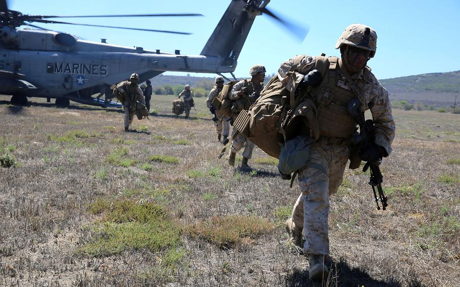 Marines with 3rd Battalion, 5th Marine Regiment, 1st Marine Division, insert into the designated landing zone during a helicopter raid, as part of the Marine Corps Combat Readiness Evaluation , at Marine Corps Base Camp Pendleton, Calif., Aug. 4, 2015.
