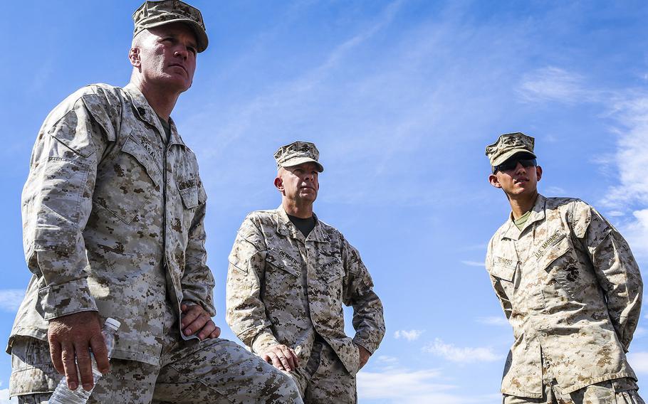 Sergeant Maj. Bradley Kasal, left, the sergeant major of I Marine Expeditionary Force, left, Lt. Gen. David H. Berger, center, commanding general of I MEF, and 1st. Lt. Bernardo Reynoso, communication officer with 1st Battalion, 7th Marine Regiment, observe Marines with 1/7 as they move into a training area during an Integrated Training Exercise aboard Marine Corps Air Ground Combat Center Twentynine Palms, Calif., Aug. 6, 2015.