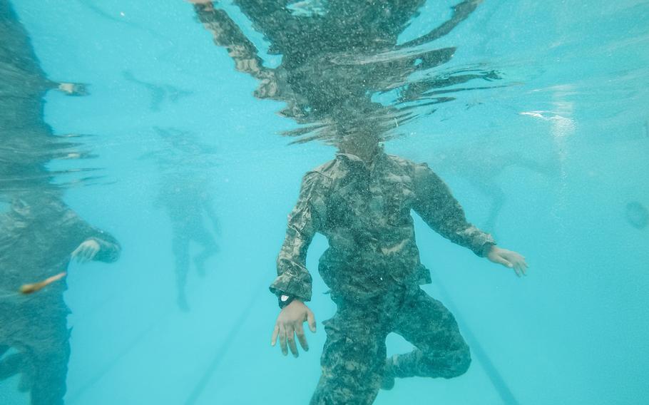 U.S. Army Reserve combat engineers from the 374th Engineer Company tread water during Combat Water Survival Training at Fort Hunter Liggett, Calif., July 17, 2015. The training was part of a two-week field exercise known as  Sapper Leader Course Prerequisite Training.