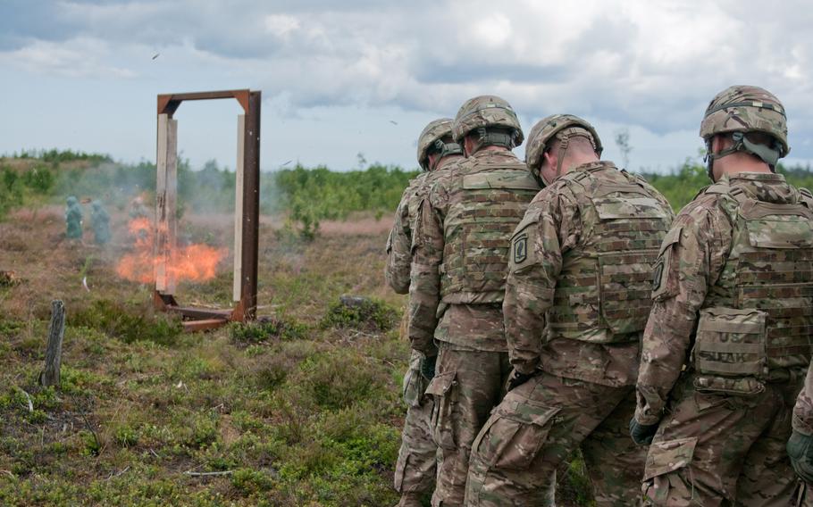 Soldiers with 503rd Infantry Regiment, 173rd Airborne Brigade Combat Team, stack up near a simulated door at the Central Training Area, near Tapa, Estonia, during Operation Atlantic Resolve, July 19, 2015. Throughout the day, soldiers practiced building and setting the various charges they had learned about the day prior.