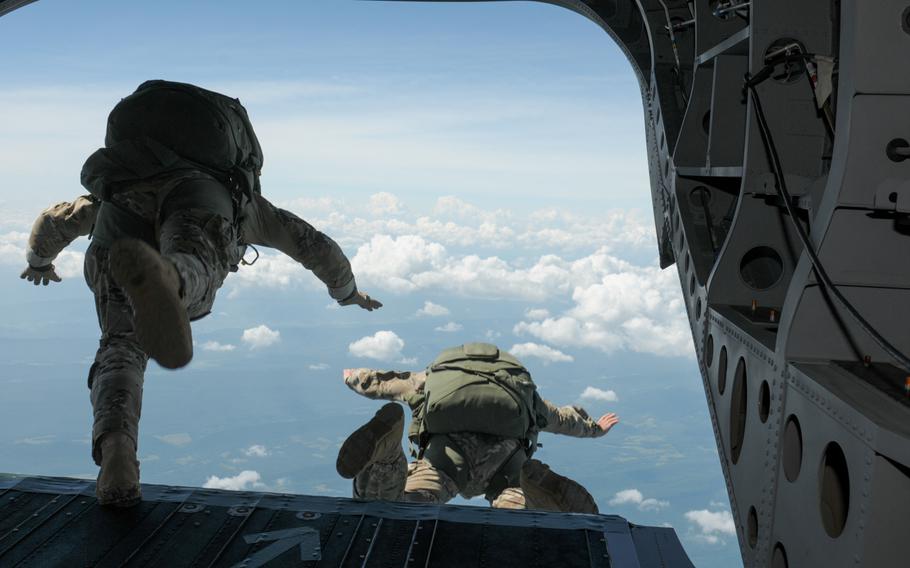Maryland Army National Guard Soldiers freefall from 13,000 feet during a jump with the 158th Cavalry Regiment, on July 18, 2015, over Little Orleans, Md.