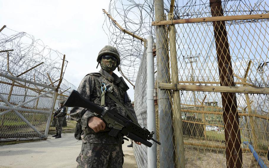 A South Korean soldier stands guard near the scene of a blast inside the Demilitarized Zone near Paju, South Korea, Aug. 9, 2015. South Korea has announced a series of measures aimed at deterring another North Korean land mine attack, from broadcasting anti-Pyongyang messages across the DMZ to changing patrol times for its soldiers.
