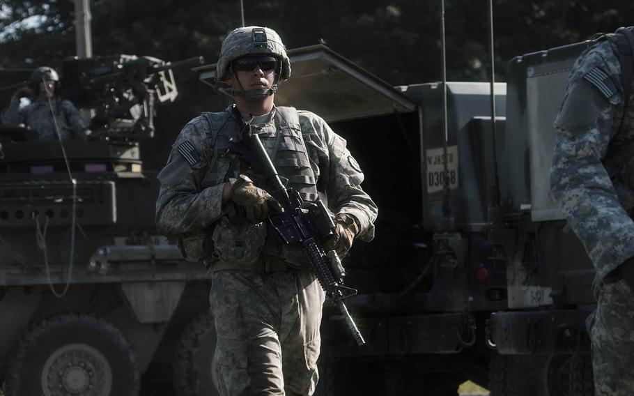 A soldier from 1st Stryker Brigade Combat Team, 25th Infantry Division awaits the start of a training mission Tuesday, Sept. 15, 2015, during the annual Orient Shield exercise.