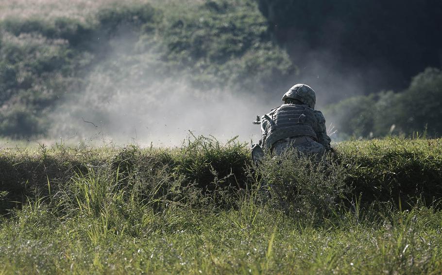 A soldier from 1st Stryker Brigade Combat Team, 25th Infantry Division fires his weapon Tuesday, Sept. 15, 2015, at the annual Orient Shield exercise in northeast Japan. The unit will train in Japan through Sept. 21 and then head to South Korea for more live-fire training near the Demilitarized Zone.