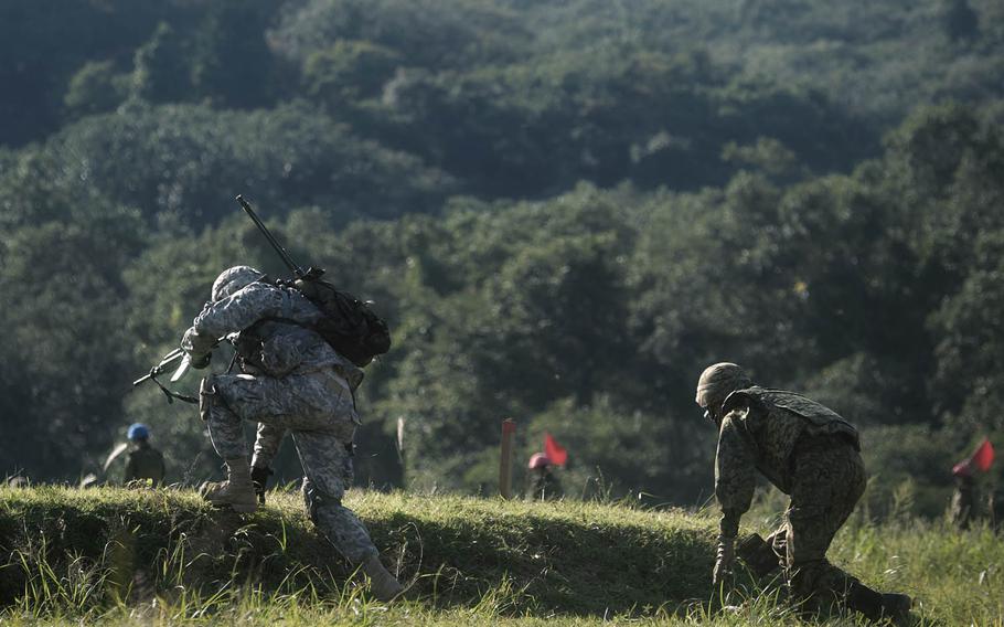 Soldiers from 1st Stryker Brigade Combat Team, 25th Infantry Division move up on their targets Tuesday, Sept. 15, 2015, during the annual Orient Shield exercise at Ojojihara Maneuver Area in northeast Japan.