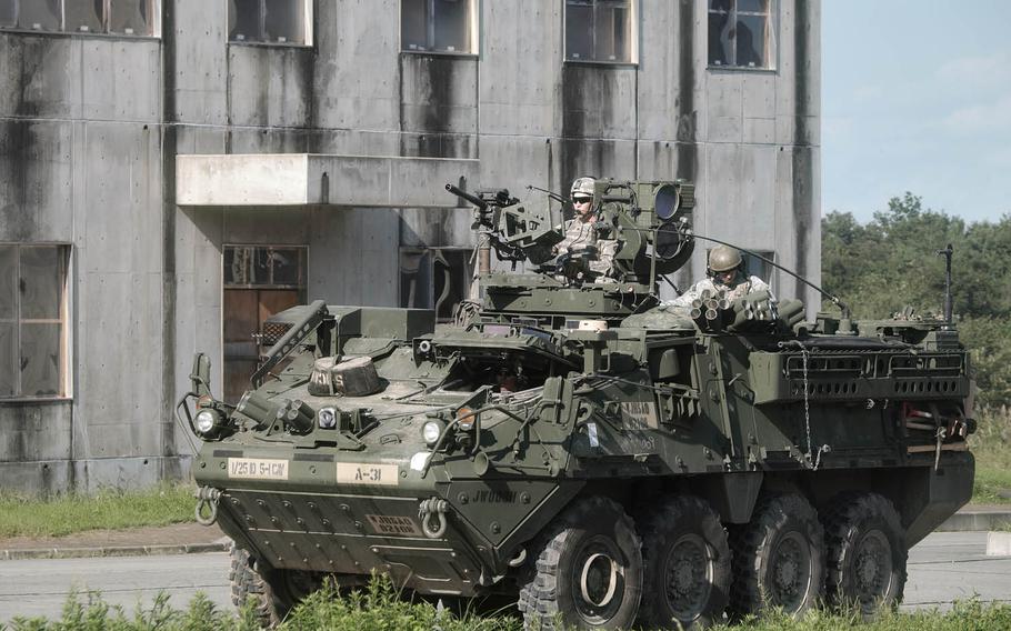 Soldiers from the U.S. Army's 1st Stryker Brigade Combat Team, 25th Infantry Division prepare for a training exercise Tuesday, Sept. 15, 2015, during Orient Shield at Ojojihara Maneuver Area in northeast Japan. About 1,700 soldiers from the U.S. Army and Japan Ground Self-Defense Force are participating in the annual exercise, which runs through Sept. 21.