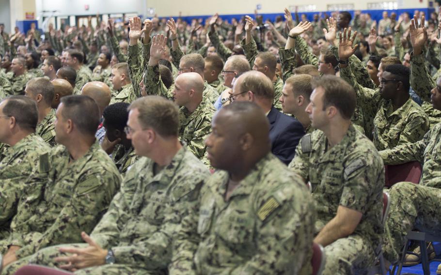 Sailors asked by Chief of Naval Operations Adm. John Richardson if they are taking an advancement exam while serving in Bahrain raise their hands during an all hands Call at Naval Support Activity, Bahrain, on Sunday, Oct. 18, 2015.